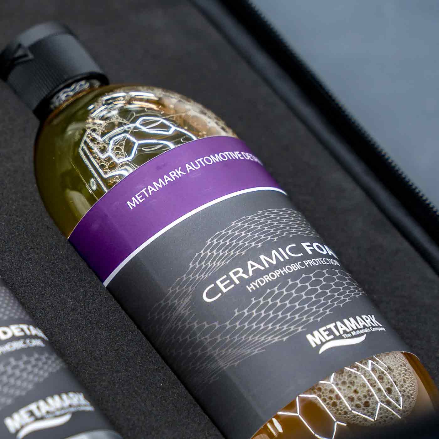 Bottle of Metamark Ceramic Foam on a car interior background